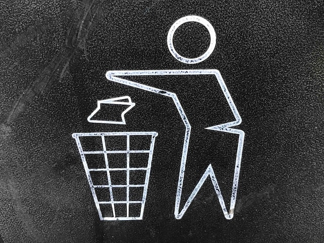 putting litter in bin sign